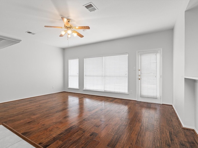 empty room featuring ceiling fan and wood-type flooring