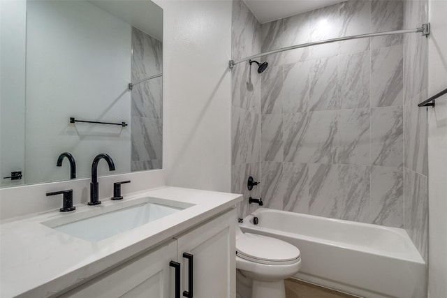 bathroom featuring toilet, vanity, and washtub / shower combination