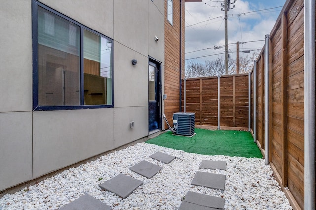 view of patio / terrace featuring a fenced backyard and central AC unit