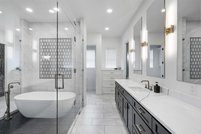 bathroom with a soaking tub, recessed lighting, a stall shower, and vanity