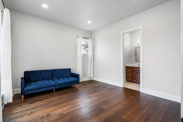 sitting room featuring wood finished floors, baseboards, and recessed lighting