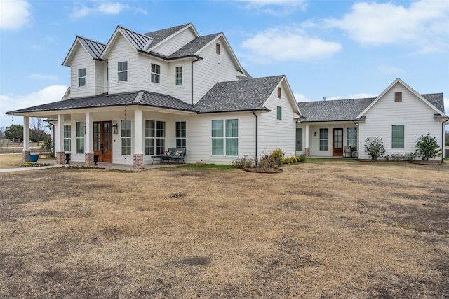 view of front of property with a front yard and a porch