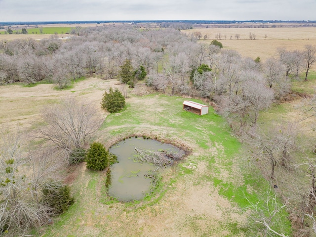 birds eye view of property with a rural view