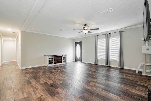 unfurnished living room with crown molding, dark hardwood / wood-style flooring, and a textured ceiling