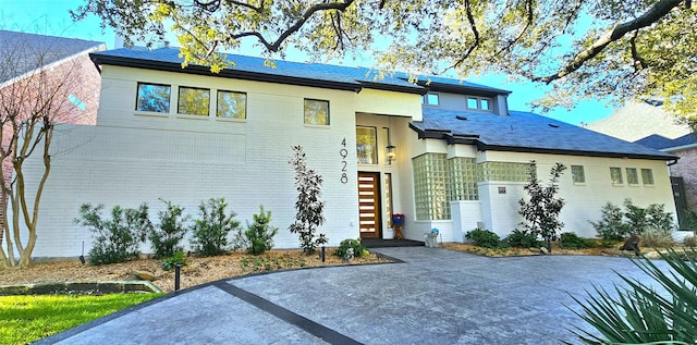 view of front of house with brick siding