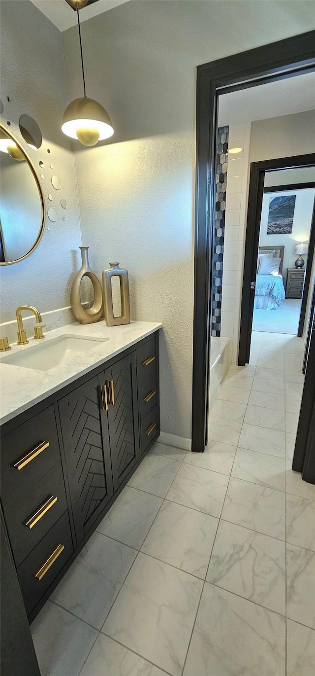 bathroom featuring vanity and marble finish floor