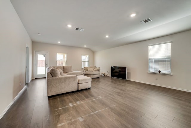 living room with lofted ceiling and hardwood / wood-style floors