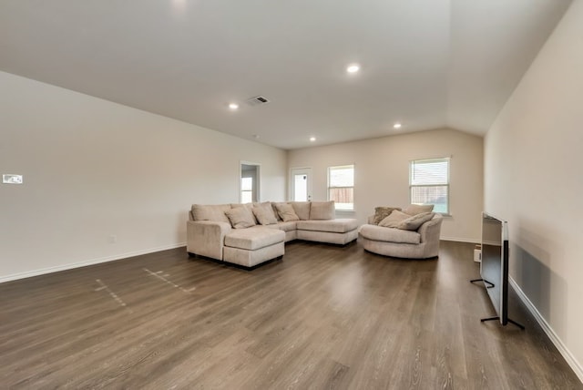 living room featuring vaulted ceiling and hardwood / wood-style floors