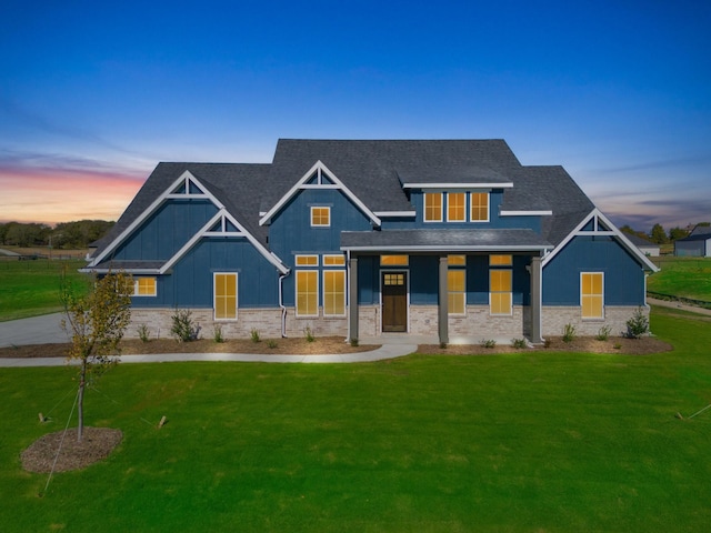 craftsman house featuring a lawn and covered porch