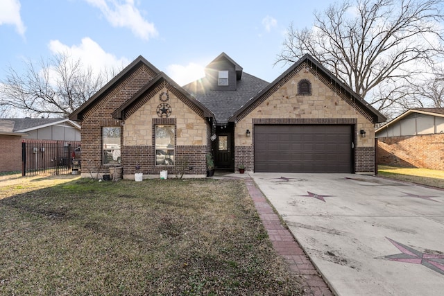 view of front of house featuring a garage and a front lawn