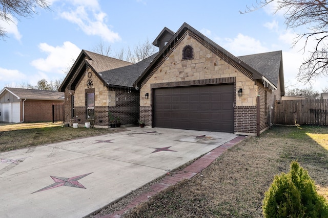 view of front facade with a garage and a front yard