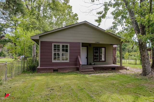 bungalow-style home featuring a front lawn and covered porch