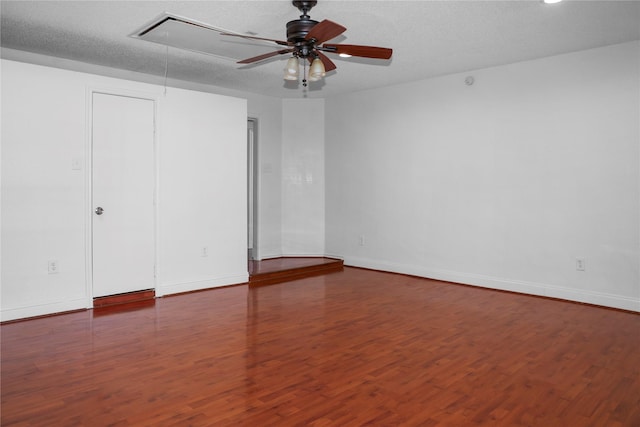 unfurnished bedroom featuring hardwood / wood-style flooring, ceiling fan, and a textured ceiling