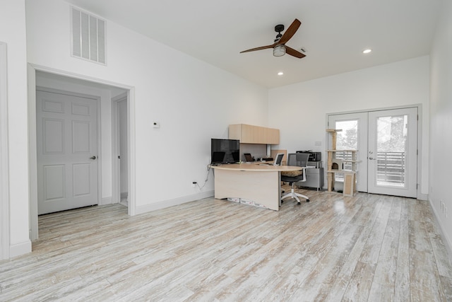 office featuring french doors, ceiling fan, and light hardwood / wood-style floors