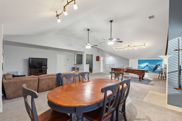 dining room featuring light carpet, track lighting, lofted ceiling, and billiards