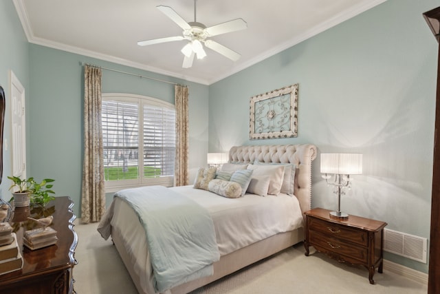 bedroom with ceiling fan, light colored carpet, and ornamental molding