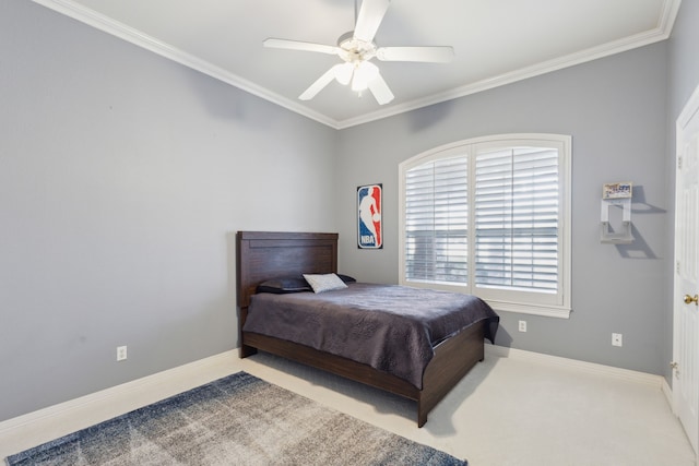 bedroom featuring crown molding, light carpet, and ceiling fan