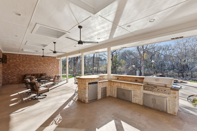 view of patio / terrace featuring area for grilling, grilling area, and ceiling fan