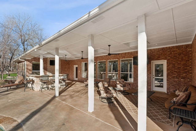 view of patio / terrace featuring ceiling fan