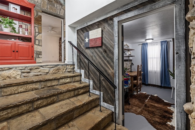 staircase with ceiling fan