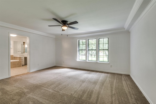 carpeted empty room with ornamental molding and ceiling fan