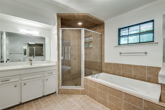 bathroom featuring vanity, crown molding, and shower with separate bathtub