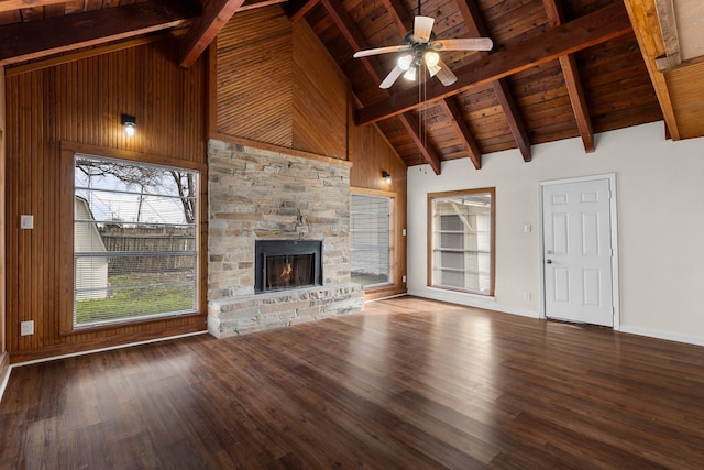 unfurnished living room featuring a stone fireplace, wooden ceiling, ceiling fan, and hardwood / wood-style flooring