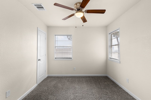 carpeted empty room with ceiling fan