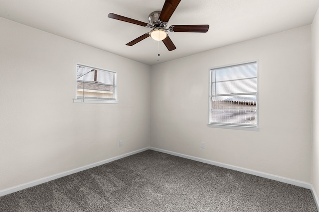 carpeted spare room with ceiling fan