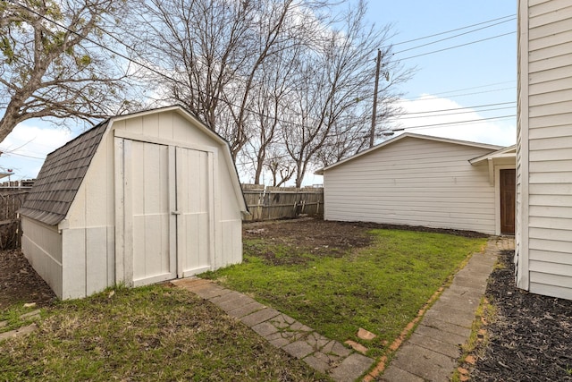 view of outbuilding featuring a yard