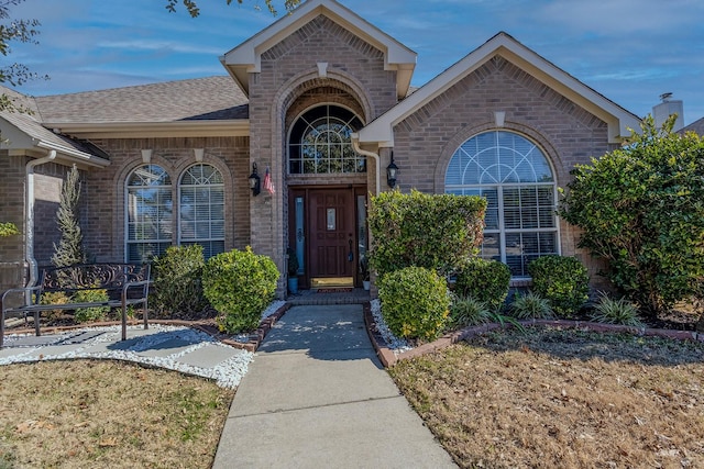 property entrance with a yard