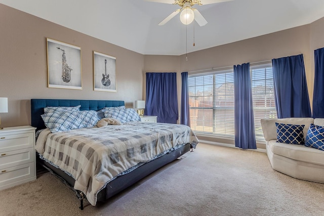 bedroom featuring ceiling fan, light colored carpet, and lofted ceiling