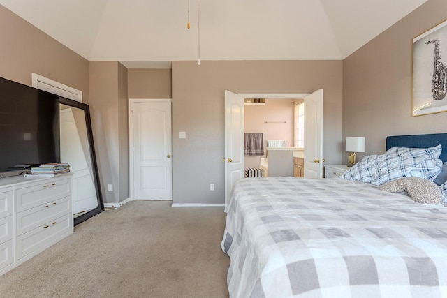 bedroom featuring vaulted ceiling and light carpet