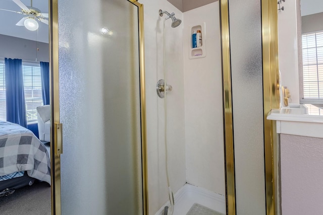 bathroom featuring a shower with shower door