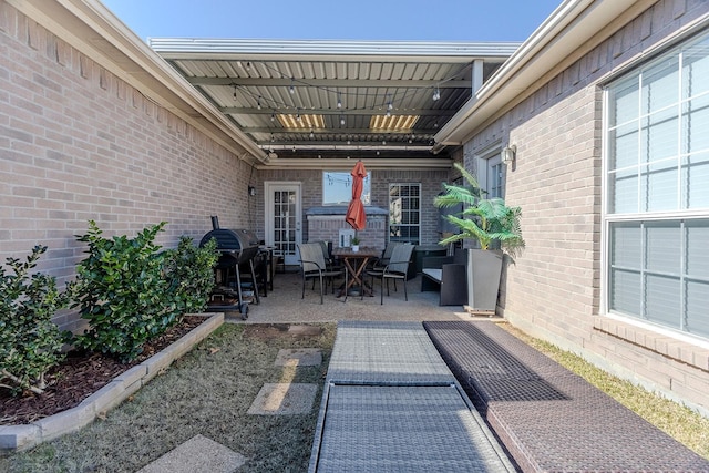 view of patio with a grill