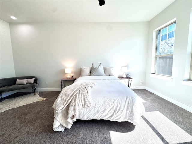 bedroom with dark carpet and ceiling fan