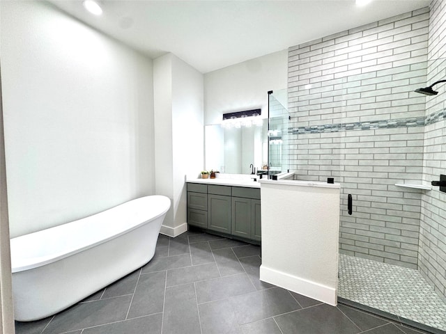 bathroom with vanity, shower with separate bathtub, and tile patterned floors