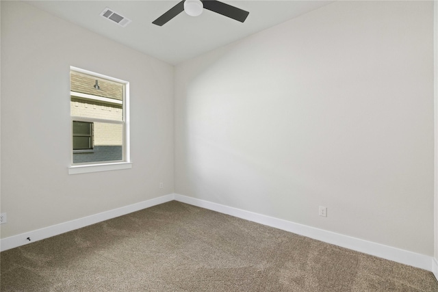 carpeted empty room featuring ceiling fan