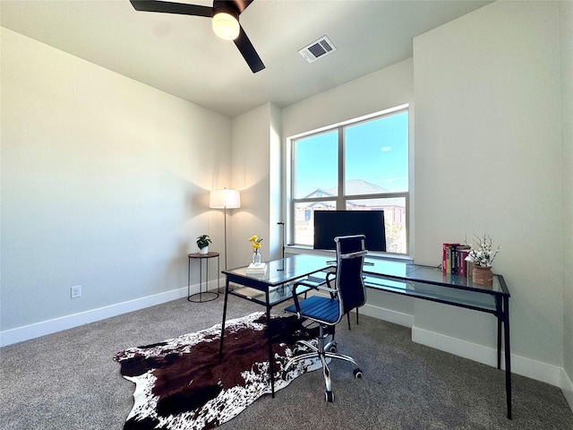 carpeted office with ceiling fan