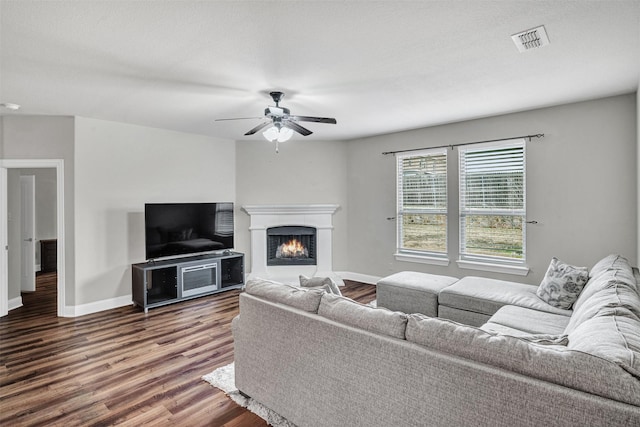 living room featuring ceiling fan and wood-type flooring