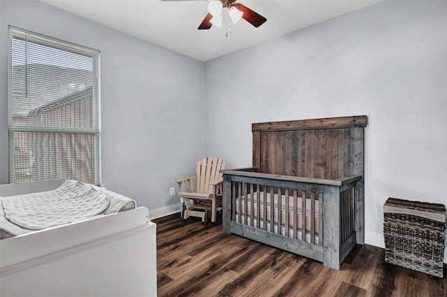 bedroom featuring dark hardwood / wood-style floors and ceiling fan