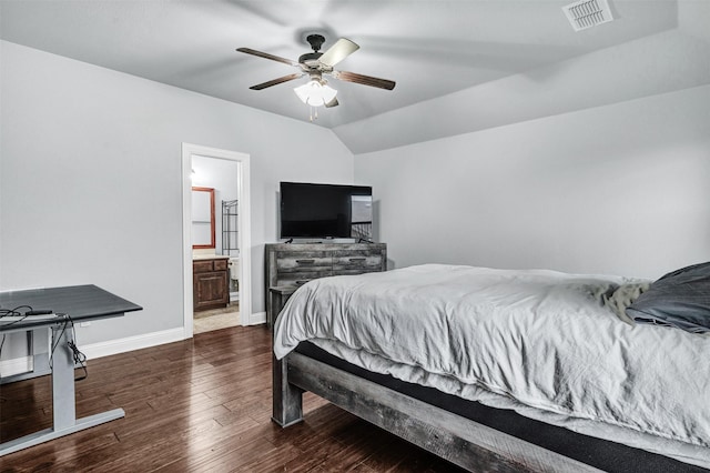 bedroom with ensuite bathroom, ceiling fan, vaulted ceiling, and dark hardwood / wood-style flooring