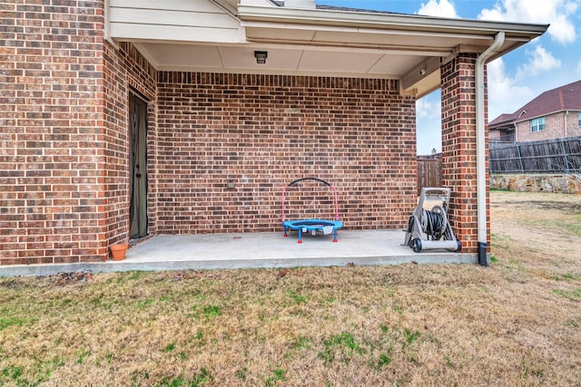 exterior space featuring a patio and a lawn