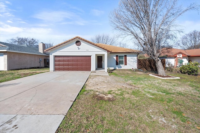 ranch-style house with a garage and a front yard