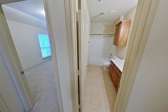 full bathroom with visible vents, shower / bathing tub combination, toilet, vanity, and tile patterned flooring