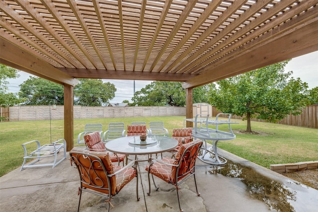 view of patio featuring a storage unit, outdoor dining space, a pergola, a fenced backyard, and an outdoor structure