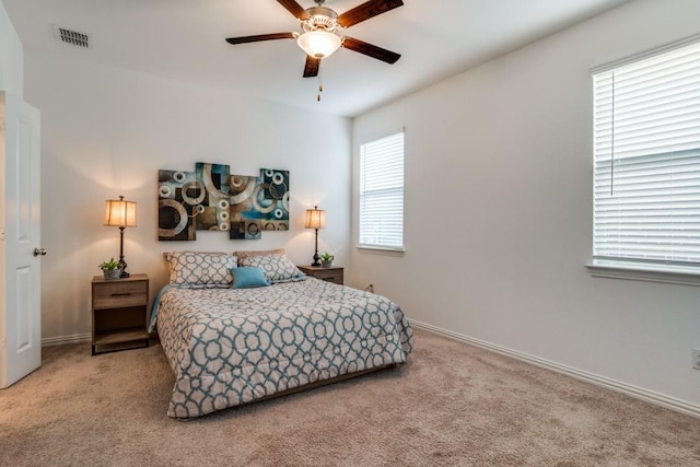 carpeted bedroom with ceiling fan