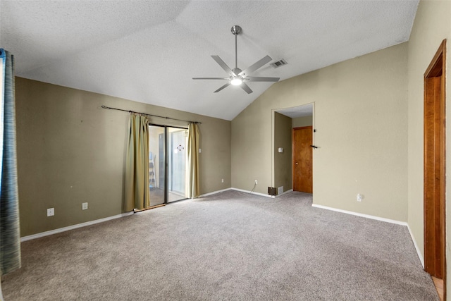 unfurnished bedroom with vaulted ceiling, access to outside, ceiling fan, light carpet, and a textured ceiling