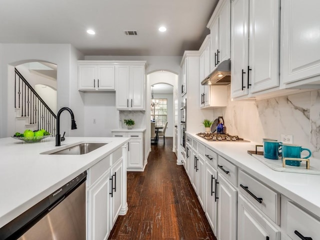 kitchen with sink, stainless steel appliances, dark hardwood / wood-style floors, and white cabinets