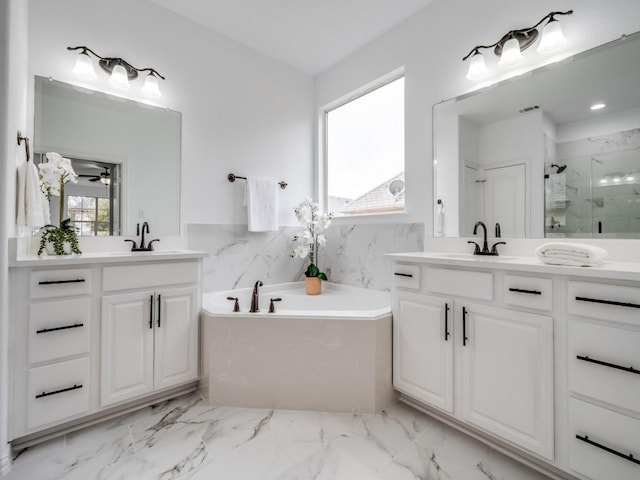 bathroom featuring vanity, tile walls, independent shower and bath, and ceiling fan